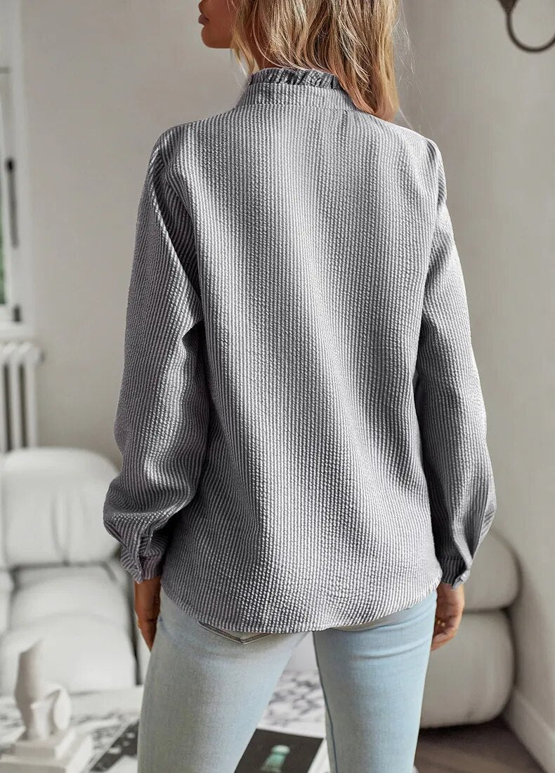 Gray Elettra women's striped ruffle long sleeve blouse, back view on the model