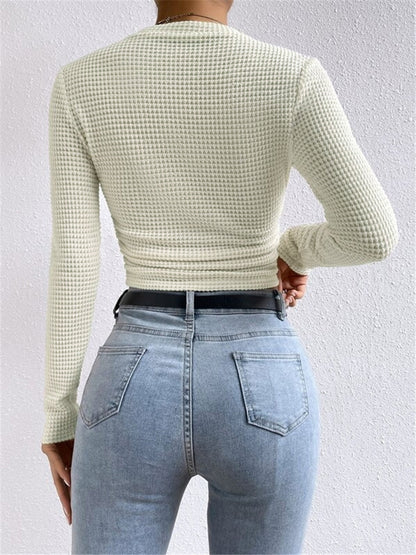 Danae Women's Textured Long Sleeve Crop Top in apricot cream, back view of waffle knit