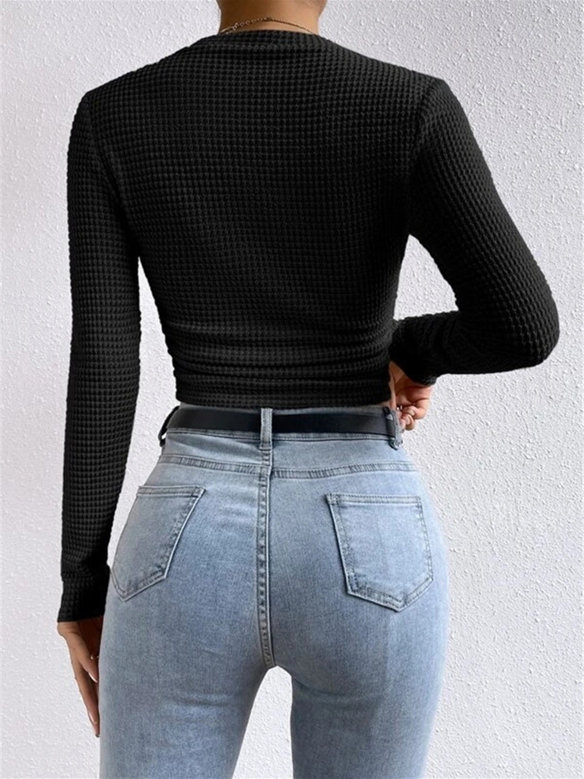 Danae Women's Textured Long Sleeve Crop Top in black, back view of cropped fit
