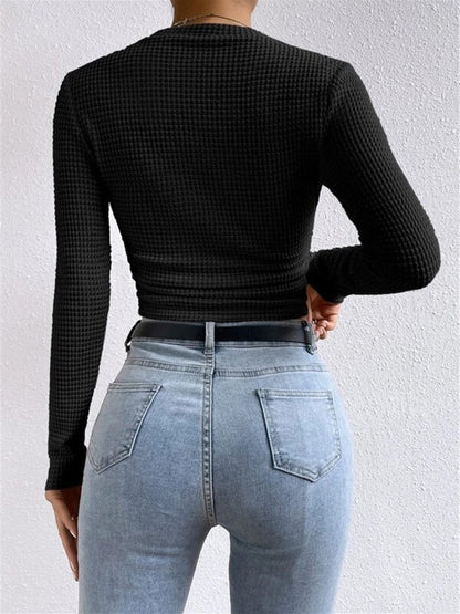 Danae Women's Textured Long Sleeve Crop Top in black, back view of cropped fit