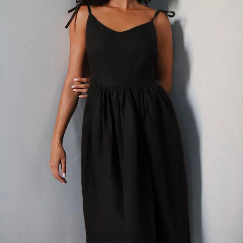 Black Eudora tie-strap maxi dress front view showing the fitted waist and full skirt