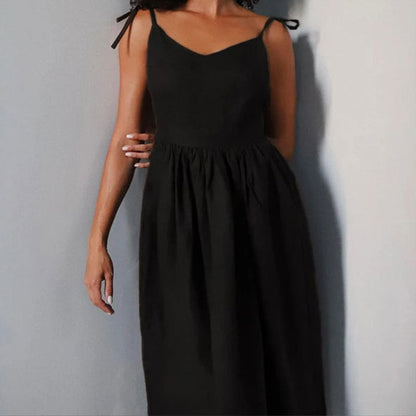 Black Eudora tie-strap maxi dress front view showing the fitted waist and full skirt