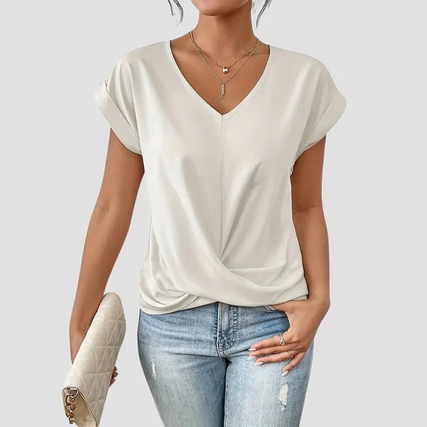 White Sancia women's twist front short sleeve blouse styled with denim jeans