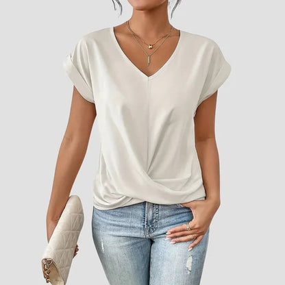 White Sancia women's twist front short sleeve blouse styled with denim jeans
