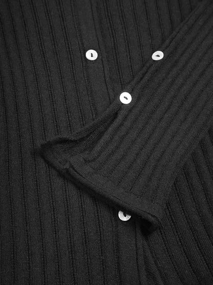 Lavinia black cardigan, close-up of pearl buttons and flared ribbed cuff