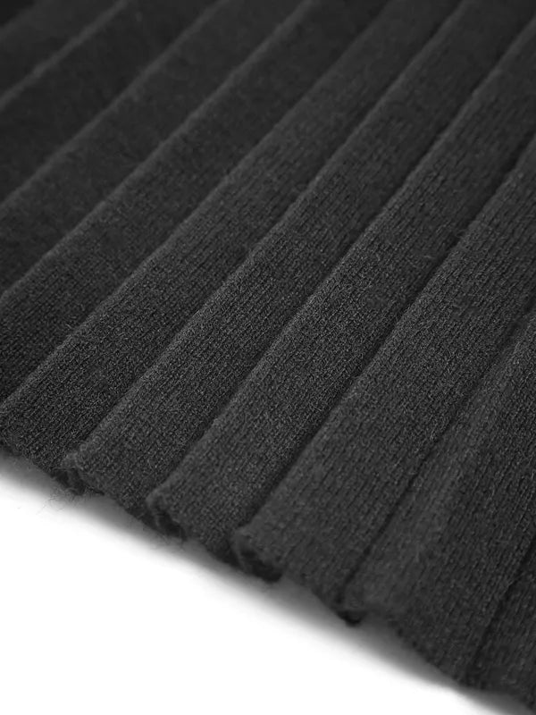 Lavinia black pleated skirt, close-up of knit pleat texture and hem