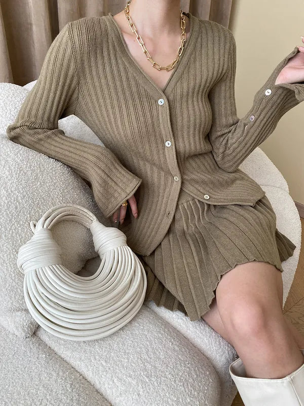 Lavinia light brown knit set, seated close front view of cardigan buttons