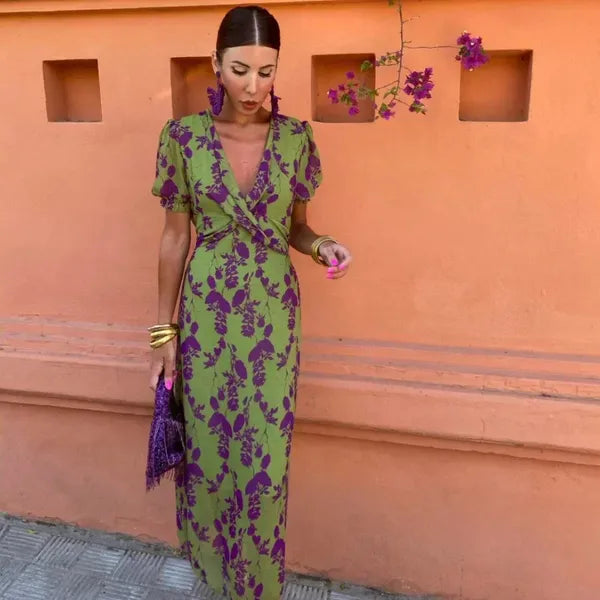 Klara women's V-neck floral wrap maxi dress in green, front view on model outdoors