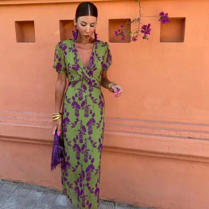 Klara women's V-neck floral wrap maxi dress in green, front view on model outdoors