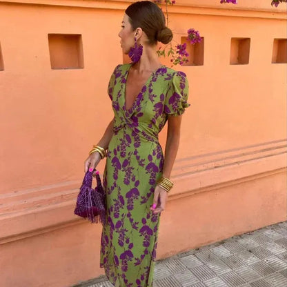 Green Klara women's V-neck floral wrap maxi dress, side view showing the long skirt