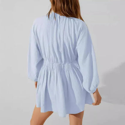 Light Blue V-Neck Mini Dress back view with shirred elastic waist and swing skirt