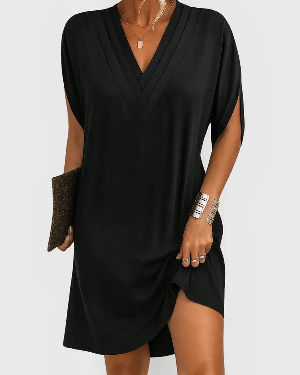 Black V-Neck Mini Dress front view with pleated V neckline and cocoon shift shape