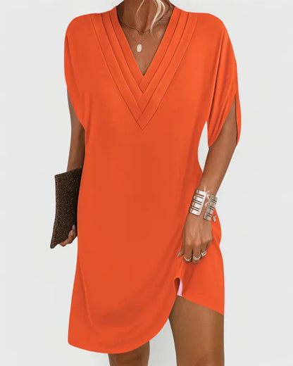 Orange V-Neck Mini Dress front view with relaxed drape and curved hem
