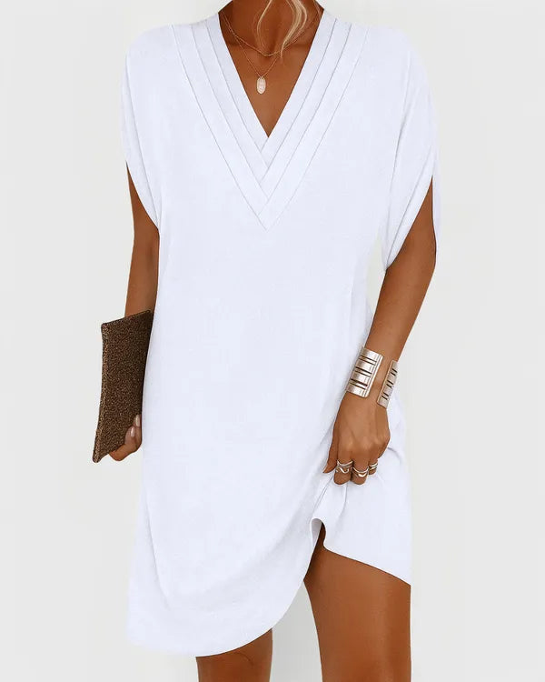 White V-Neck Mini Dress front view with pintucked neckline and soft shift cut