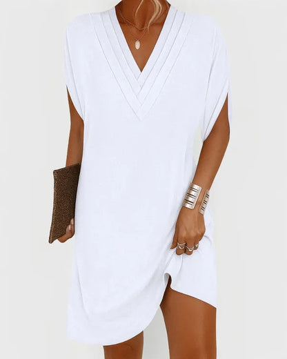 White V-Neck Mini Dress front view with pintucked neckline and soft shift cut