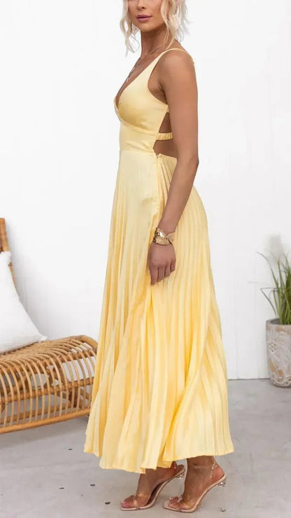 Aveline yellow pleated maxi dress for women, side view showing the flowing pleats