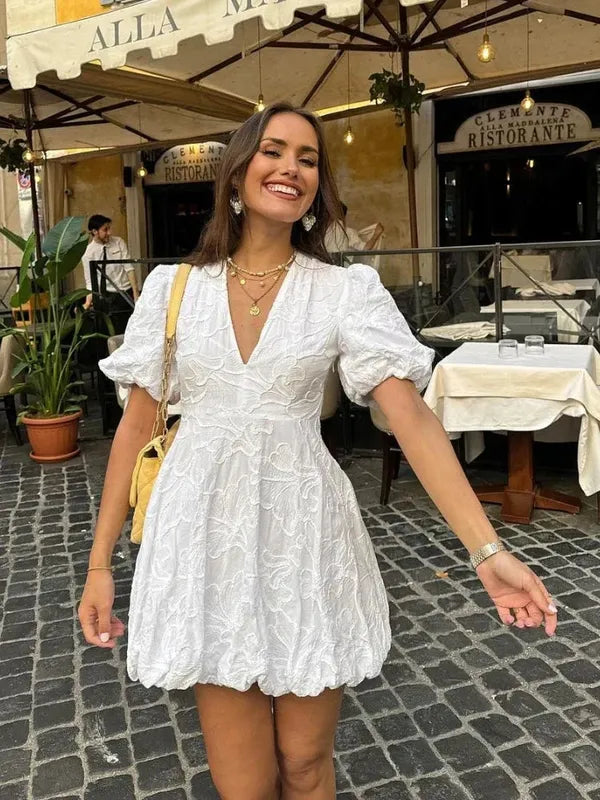 White V-Neck Puff Sleeve Mini Dress front view with textured embroidery and bubble hem