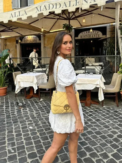 White V-Neck Puff Sleeve Mini Dress side view showing puff sleeves and short hem