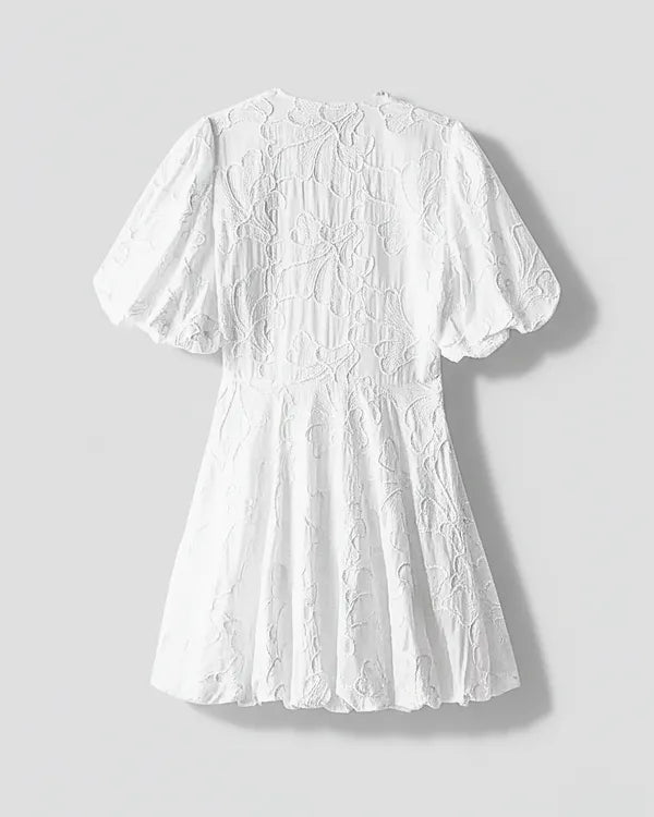 White V-Neck Puff Sleeve Mini Dress flatlay back view with embroidered texture