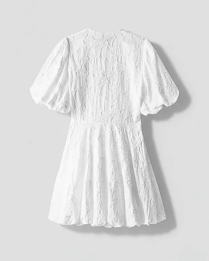 White V-Neck Puff Sleeve Mini Dress flatlay back view with embroidered texture