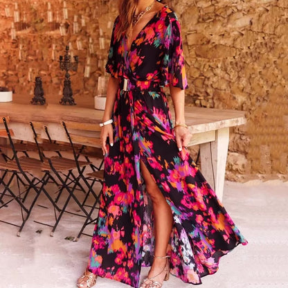 Olwen women's V-neck wrap maxi dress in black with bright floral print, front view