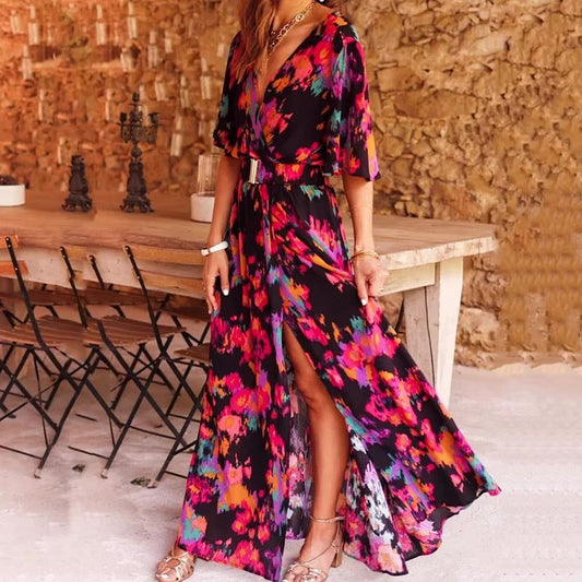 Olwen women's V-neck wrap maxi dress in black with bright floral print, front view