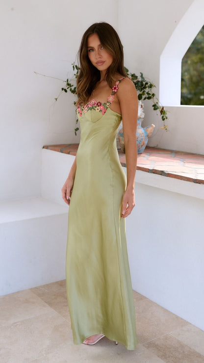 Lucienne lime satin slip maxi dress for women, side view against a white wall