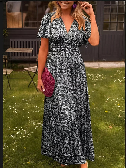 Black Honoria women's wedding guest floral wrap maxi dress, front view on model