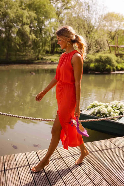 Women's Wedding Guest Satin Midi Halter Dress – Juliana in Orange, side view on model