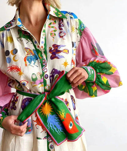 Close-up of the multicolor print and green tie belt on the Cersi women's maxi dress
