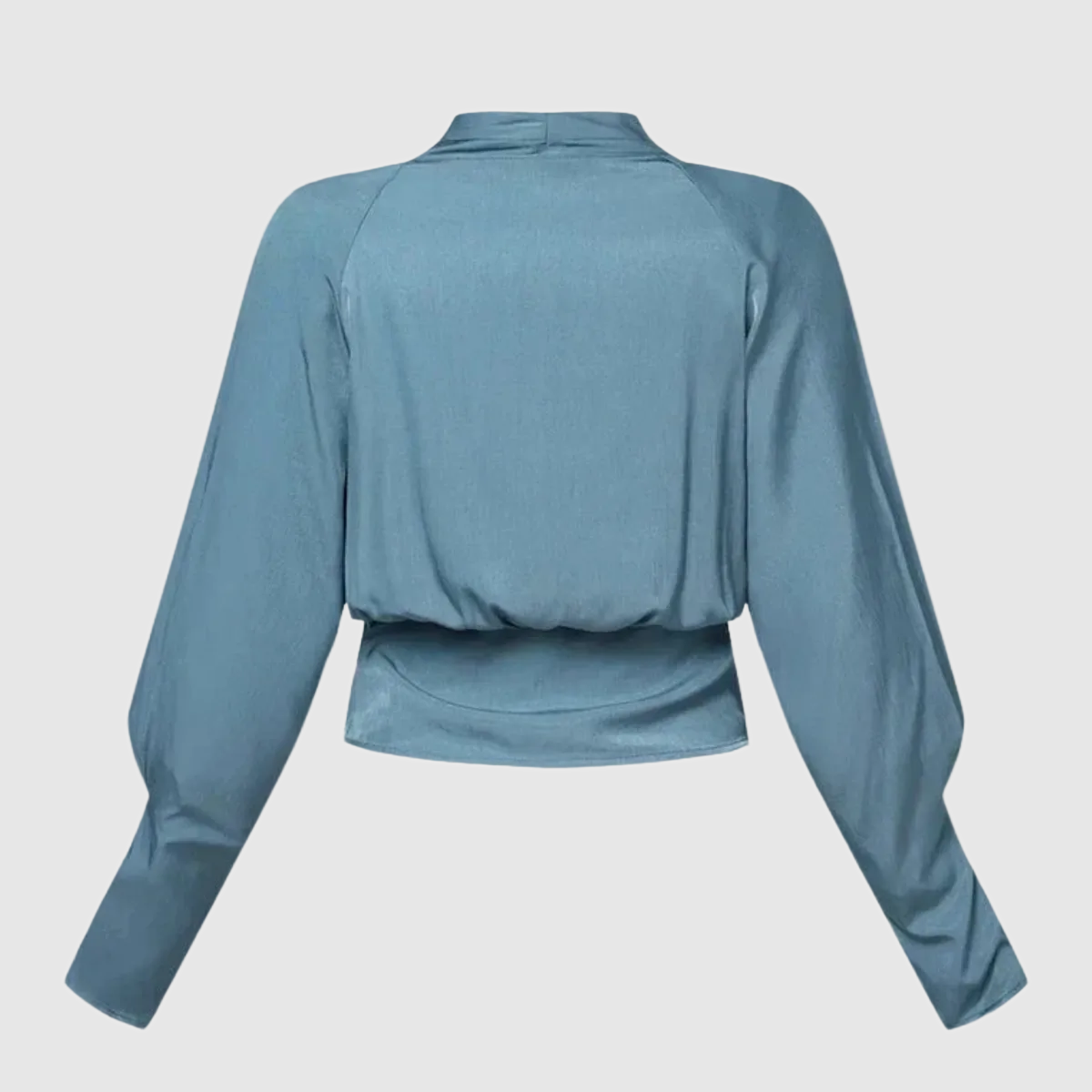 Blue Thalassa women's wrap V-neck blouse, flat back view of the blouson hem